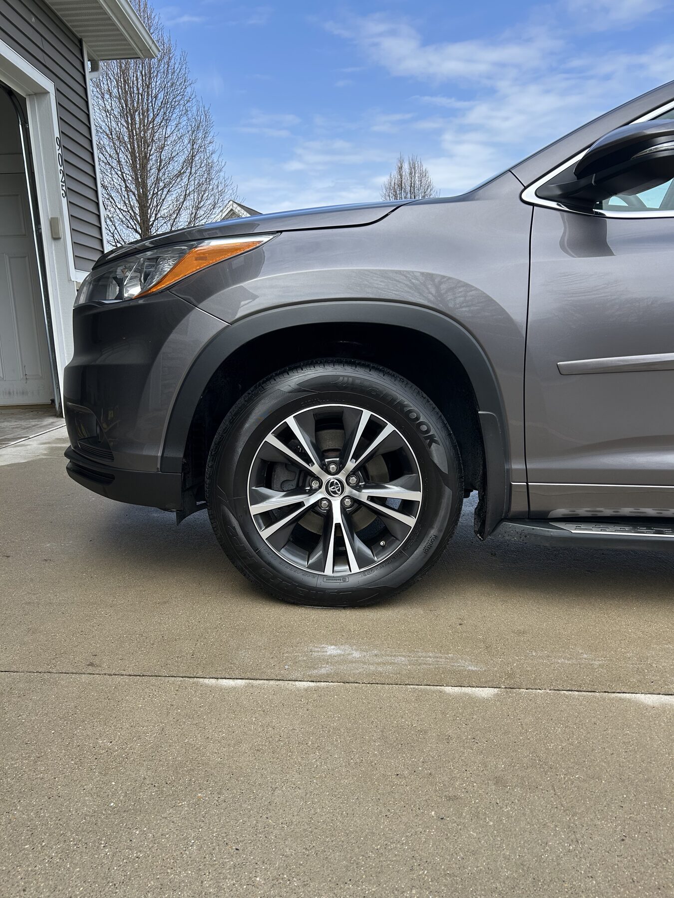 Detailer washing truck at customer's home